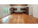 Spacious kitchen with dark wood cabinetry, island, hardwood floors, and natural light at 5035 Villa Rica Hwy, Dallas, GA 30157