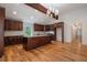 Stylish kitchen featuring an island, granite countertops, stainless appliances, and hardwood flooring at 5035 Villa Rica Hwy, Dallas, GA 30157