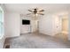 Carpeted main bedroom with a wall-mounted TV and an open door to the bathroom at 5035 Villa Rica Hwy, Dallas, GA 30157