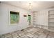 View of the mud room with tile flooring, storage, a coat rack, a window and an entry door at 5035 Villa Rica Hwy, Dallas, GA 30157