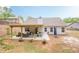 Expansive backyard features a covered patio, outdoor seating, and a well-maintained lawn at 549 Greenridge Ln, Loganville, GA 30052