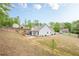 Spacious backyard featuring a patio, wooden fence, and ample green space at 549 Greenridge Ln, Loganville, GA 30052