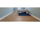 Bedroom with light-blue walls, wood floors, and large rug at 549 Greenridge Ln, Loganville, GA 30052