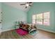 Bright bedroom with a ceiling fan, double closet doors and an ensuite bathroom at 549 Greenridge Ln, Loganville, GA 30052