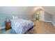 Bedroom with light-blue walls, wood floors, side table and closet access at 549 Greenridge Ln, Loganville, GA 30052