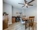 Dining area featuring stylish ceiling fan, with built-in shelving and wood-look flooring at 549 Greenridge Ln, Loganville, GA 30052