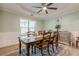 Dining room featuring a classic table set, chair rail molding, and a decorative light fixture at 549 Greenridge Ln, Loganville, GA 30052