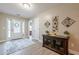 Welcoming home foyer with a decorative console table and view of the front door at 549 Greenridge Ln, Loganville, GA 30052