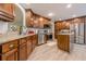 Spacious kitchen featuring stainless appliances, granite counters, and ample storage in wood cabinetry at 549 Greenridge Ln, Loganville, GA 30052