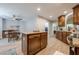Open concept kitchen with kitchen island, breakfast nook, wood cabinets, and stainless appliances at 549 Greenridge Ln, Loganville, GA 30052
