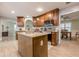Well-equipped kitchen with stainless steel appliances, a kitchen island, and beautiful wood cabinets at 549 Greenridge Ln, Loganville, GA 30052
