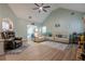 Spacious living room with a stone fireplace, vaulted ceilings, and modern décor at 549 Greenridge Ln, Loganville, GA 30052
