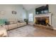 Comfortable living room with a stone fireplace and neutral-toned furniture at 549 Greenridge Ln, Loganville, GA 30052