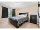 Bedroom with neutral walls, carpet floors and a window at 1057 Cotton Oak Dr, Lawrenceville, GA 30045