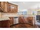 Spacious kitchen featuring granite countertops, stainless steel dishwasher, and hardwood flooring at 1057 Cotton Oak Dr, Lawrenceville, GA 30045