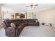 Open-concept living room featuring a comfortable sofa and view of the kitchen area at 1057 Cotton Oak Dr, Lawrenceville, GA 30045