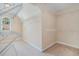 Walk-in closet offering ample storage with built-in shelving and carpet floors at 1057 Cotton Oak Dr, Lawrenceville, GA 30045