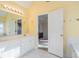 Spacious bathroom with tile floor, a large vanity with double sinks and tile flooring at 2118 Sableshire Se Way, Conyers, GA 30013