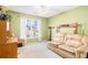 Cozy bedroom with a large window letting in natural light at 2118 Sableshire Se Way, Conyers, GA 30013