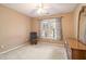 Bedroom with a window and neutral walls at 2118 Sableshire Se Way, Conyers, GA 30013