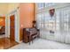 Foyer showcasing a classic piano and large windows, offering ample natural light at 2118 Sableshire Se Way, Conyers, GA 30013