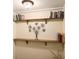Hallway with decorative shelves and a metal tree sculpture at 2118 Sableshire Se Way, Conyers, GA 30013