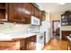 Well-equipped kitchen with hardwood floors and ample storage at 2118 Sableshire Se Way, Conyers, GA 30013