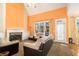 Spacious living room with fireplace, large windows, and sliding glass door at 2118 Sableshire Se Way, Conyers, GA 30013