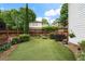 Green backyard featuring well-manicured garden and lawn at 215 Scott Xing, Roswell, GA 30076