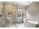 Light and bright bathroom showcasing glass shower and soaking tub at 215 Scott Xing, Roswell, GA 30076