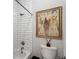 Bathroom featuring a shower with white subway tile surround, a toilet, and framed wall art at 215 Scott Xing, Roswell, GA 30076
