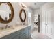 Elegant bathroom featuring a dual sink vanity and wood framed mirrors at 215 Scott Xing, Roswell, GA 30076