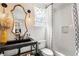 Bathroom with updated vanity, framed mirror, new fixtures, and shower at 215 Scott Xing, Roswell, GA 30076