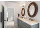 Elegant bathroom featuring a dual sink vanity and wood framed mirrors at 215 Scott Xing, Roswell, GA 30076