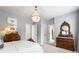 Bright bedroom with natural light and wood dressers at 215 Scott Xing, Roswell, GA 30076