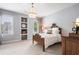 Serene bedroom with a chandelier, neutral tones, and built in shelves at 215 Scott Xing, Roswell, GA 30076