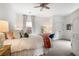 Comfortable bedroom with plush carpet, ceiling fan, a bright window, and white armoire at 215 Scott Xing, Roswell, GA 30076