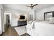 Bright bedroom featuring four-poster bed and television at 215 Scott Xing, Roswell, GA 30076