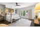 Bright bedroom featuring four-poster bed and designer rug at 215 Scott Xing, Roswell, GA 30076
