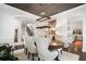 Dining area with arched doorways, a statement chandelier, and easy access to the kitchen at 215 Scott Xing, Roswell, GA 30076