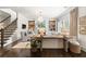Elegant living room with fireplace, built-in bookshelves, and large windows at 215 Scott Xing, Roswell, GA 30076