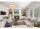 Elegant living room with fireplace, built-in bookshelves, and large windows at 215 Scott Xing, Roswell, GA 30076
