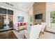 Cozy living area with a stone fireplace, wine storage, and bright, modern décor at 215 Scott Xing, Roswell, GA 30076
