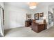 Well-lit home office featuring a spacious carpet, crown molding, and a classic wooden desk at 215 Scott Xing, Roswell, GA 30076