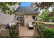 Cozy brick patio featuring a comfortable seating area and manicured landscaping at 215 Scott Xing, Roswell, GA 30076