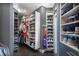 Well-organized walk-in closet with custom shelves and shoe storage at 215 Scott Xing, Roswell, GA 30076