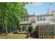 Landscaped backyard with a patio, chairs, and a privacy fence, perfect for outdoor gatherings at 3618 Berkeley Ct # Iv-A, Duluth, GA 30096