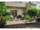 Backyard patio with outdoor seating, lush plants, and string lights, creating a cozy and inviting atmosphere at 3618 Berkeley Ct # Iv-A, Duluth, GA 30096