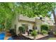 Cozy backyard patio with string lights, lush plants, and a charming outdoor seating area, creating a relaxing retreat at 3618 Berkeley Ct # Iv-A, Duluth, GA 30096