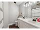 Modern bathroom with a double sink vanity, decorative lights, and a shower with a stylish curtain at 3618 Berkeley Ct # Iv-A, Duluth, GA 30096